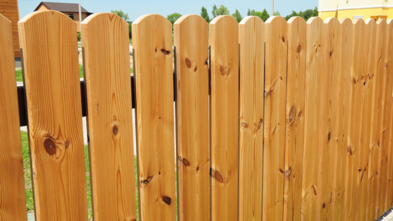 Newly repaired timber fence in Melbourne, Victoria, featuring clean, evenly spaced wooden pickets for a secure residential boundary.